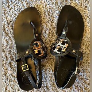 Tory Burch “Holly” black leather sandals with silver TB logo inset. 9.5